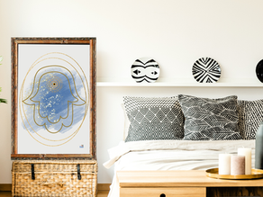 Artful Hamsa design exuding calmness and tranquility, elegantly framed and set in a modern, minimalist bedroom with complementary black and white patterns.
