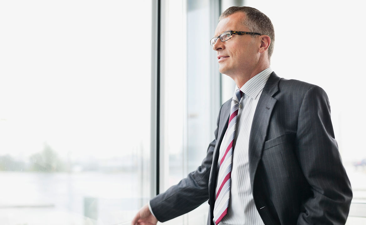 Businessman Gazing Out Window