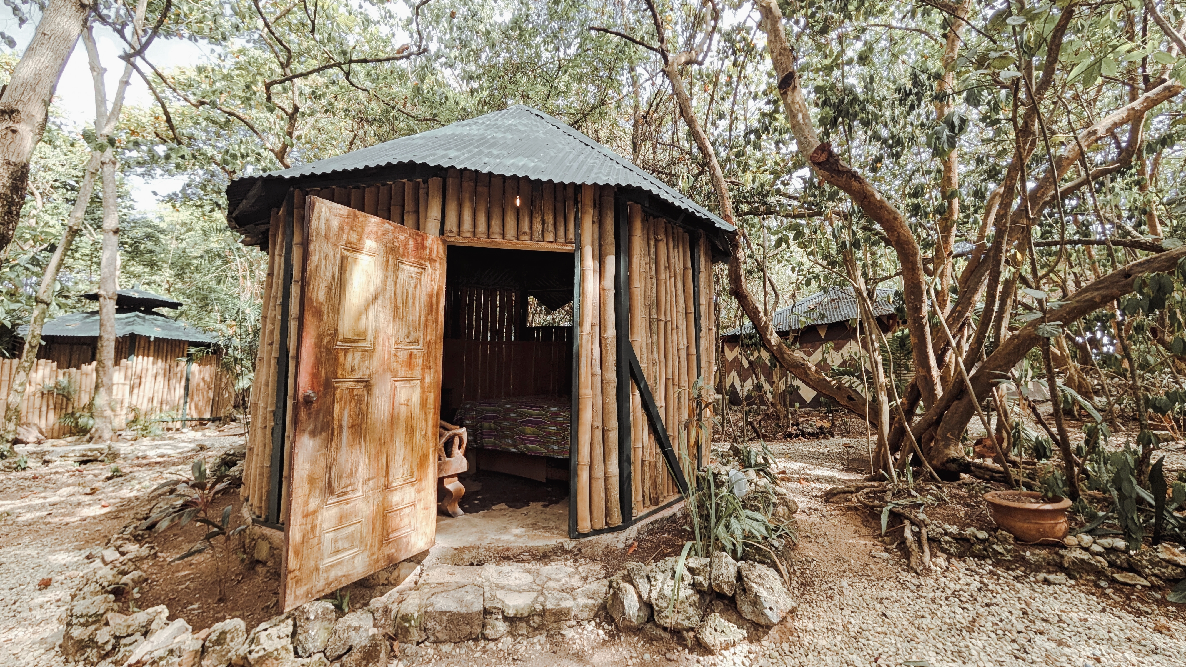 Bar area with locally inspired decor at Great Huts eco resort in Portland Jamaica