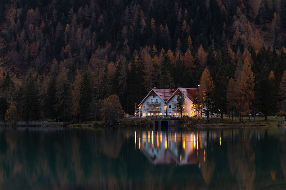 Vacation rental cabin exterior at dusk — pricing strategy for short-term rentals