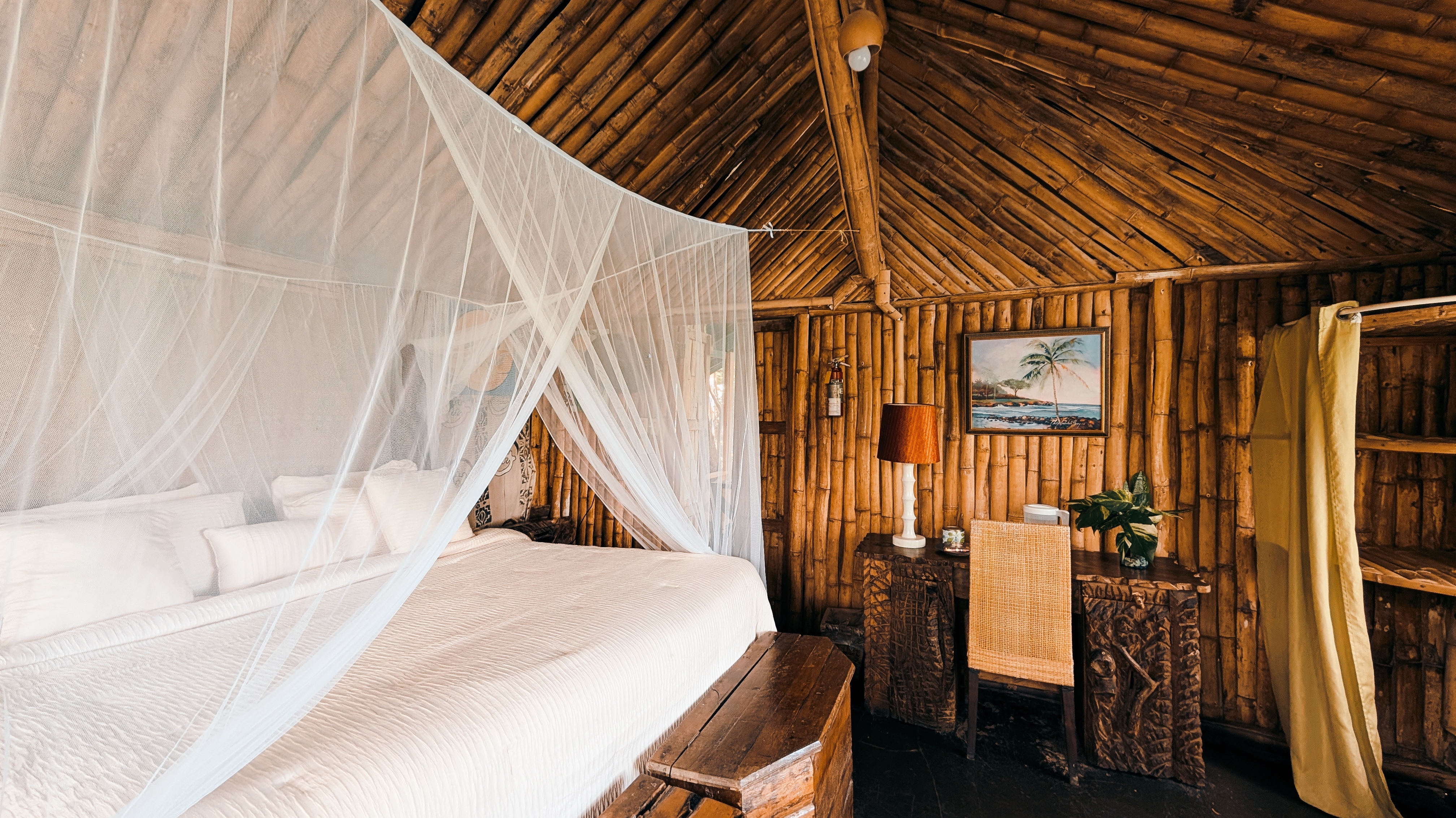 Candlelit dinner setting above the sea at Great Huts romantic wellness escape