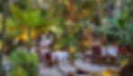 Romantic beachfront dining setup at La Palapa with ocean waves in the background