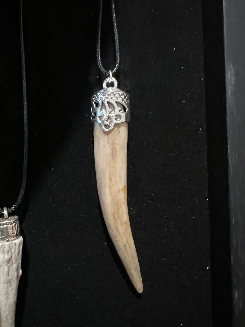 Thumbnail: Each carved bone pendant sold separately