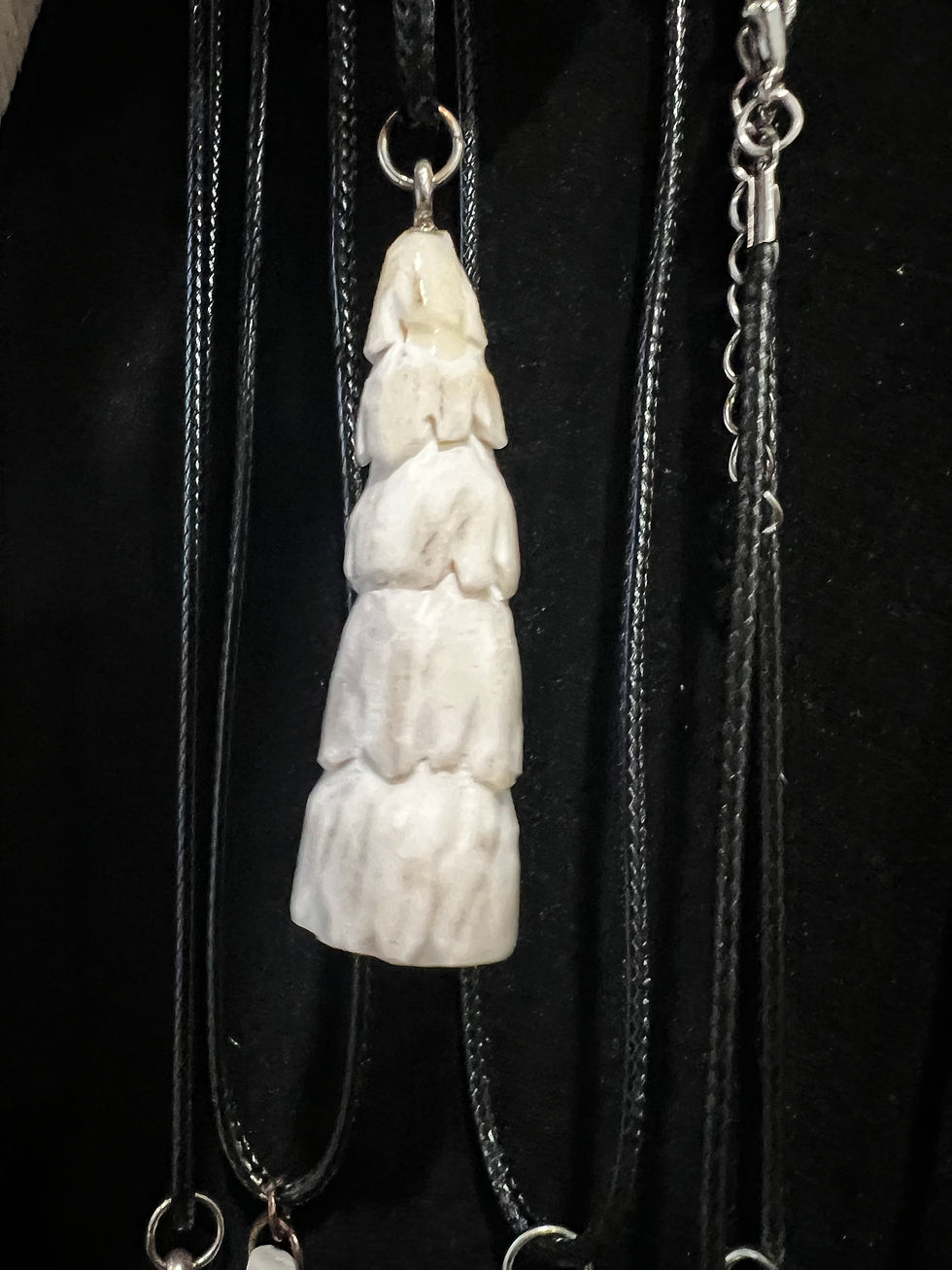 Thumbnail: Each carved bone pendant sold separately