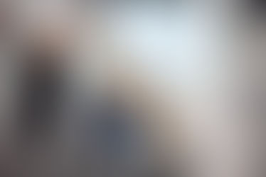 wheelchair user with a walking stick and a mask