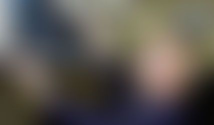 cabin attendant checking overhead bin in aircraft cabin