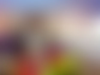 passenger waiting to collect checked baggage from carousel in baggage claim area