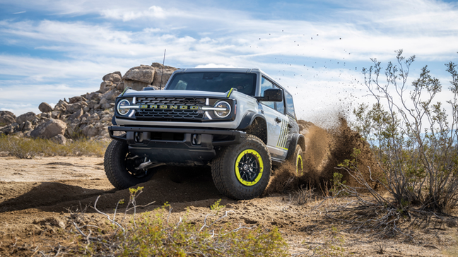 2027 Ford Bronco RTR unveiled in Detroit shown in front three-quarter view with RTR grille, Hyper Lime accents, rugged tires and raised suspension