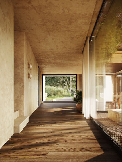 Warm, natural-toned hallway at Malle Japie with wooden flooring, soft light and views towards the garden