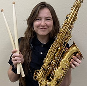 Katie holding a saxophone
