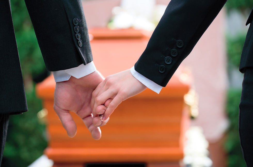 Man & child holding hands at funeral