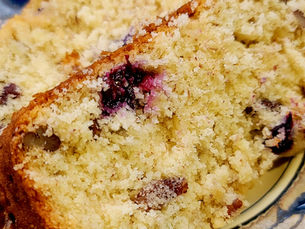 A photo of two slices of Vegan Blueberry Banana Nut Bread