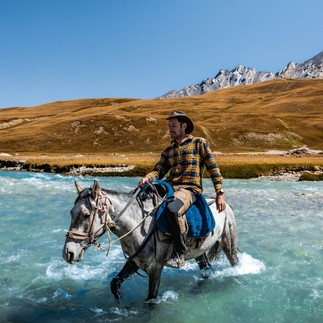 Kel-Suu Lake in Kyrgyzstan on a horse