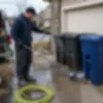 Comparing garden hose rinse to pressure washer on trash cans in Elkton