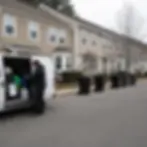 Service van and trash cans lined up at the curb on a scheduled cleaning day in Elkton
