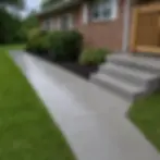 Clean concrete sidewalk and steps at brick rancher home in Elkton