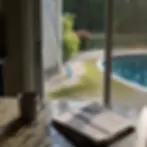 Homeowner views algae-stained pool deck through kitchen window in Elkton