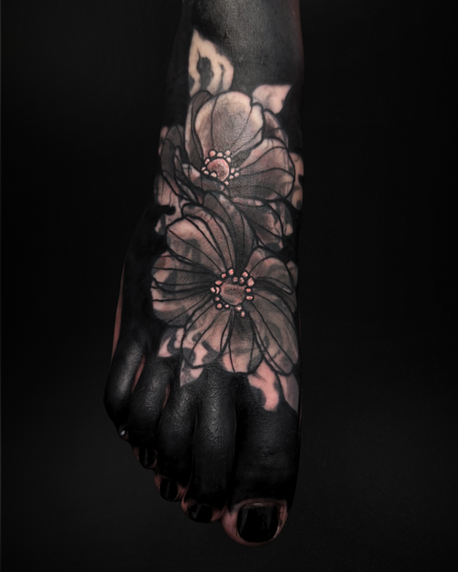 Blackout floral blast over tattoo coverup on the foot