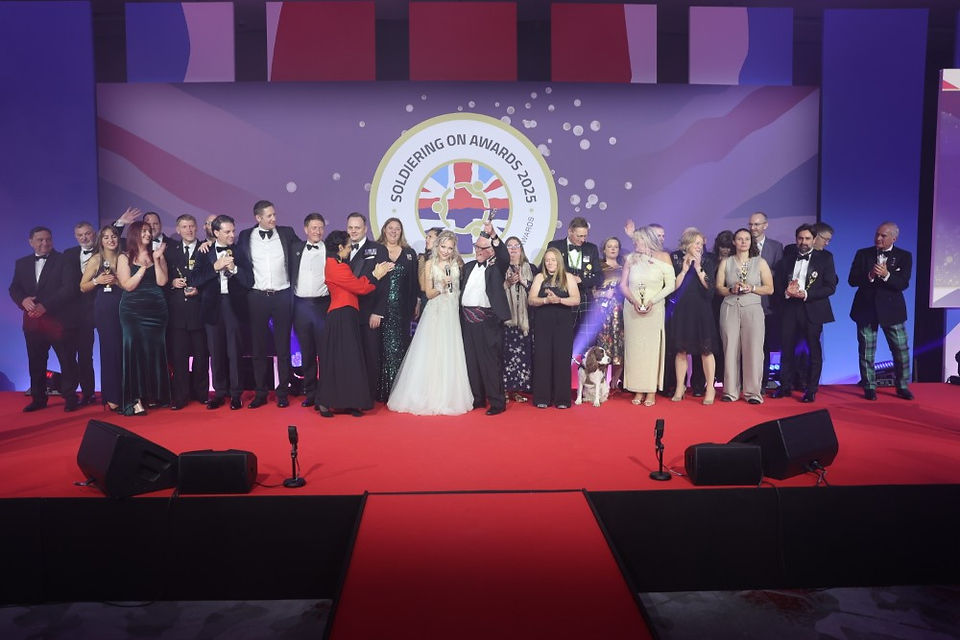 A group of winners from last year's Awards on stage at the end of the evening with singer Chrissie Johnston