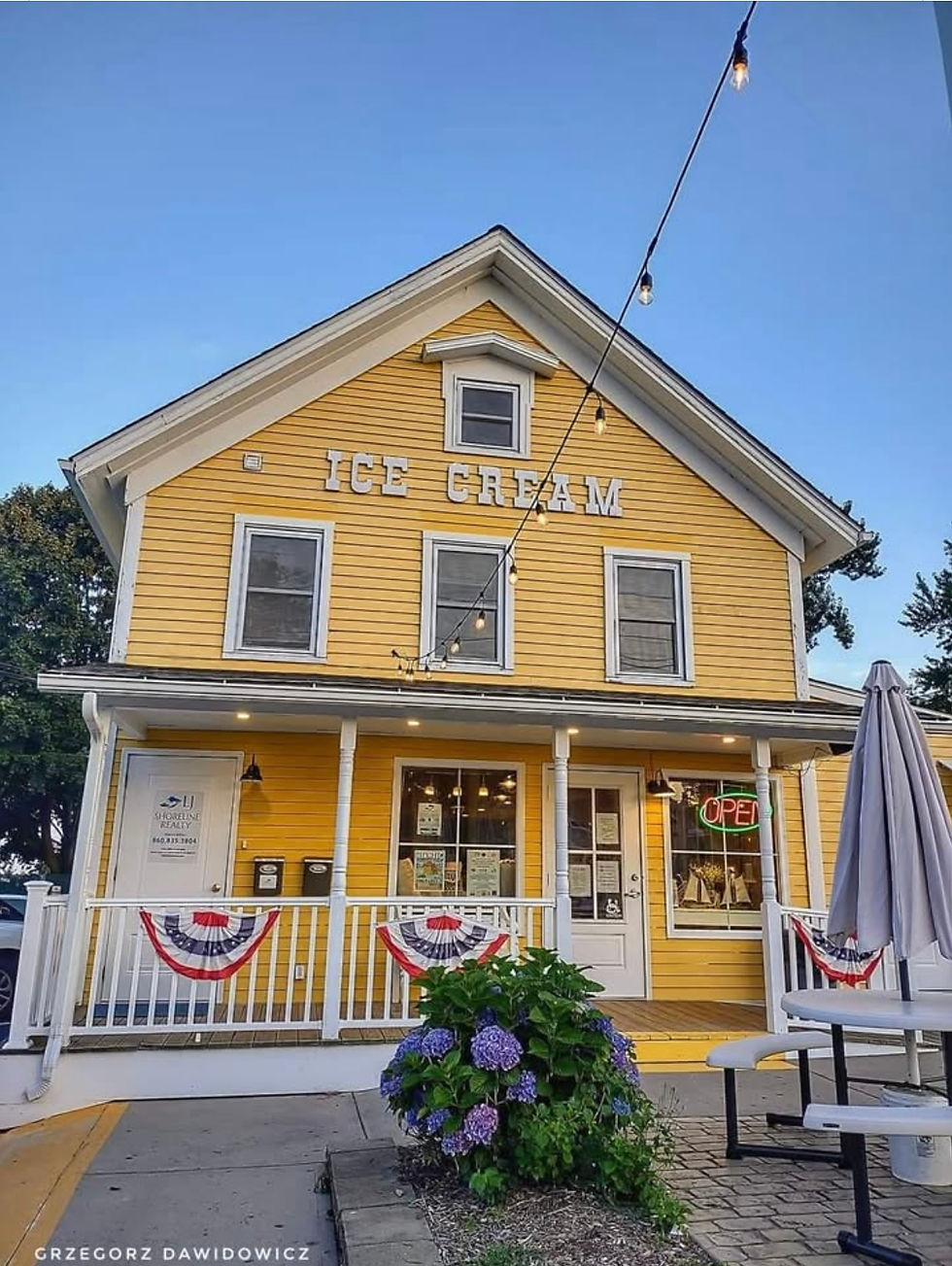 The yellow storefront of Gumdrops n Lollipops candy shop and ice cream parlor on Main Street in Niantic, CT
