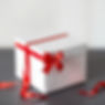 wrapt gift box in white and a red ribbon.jpg