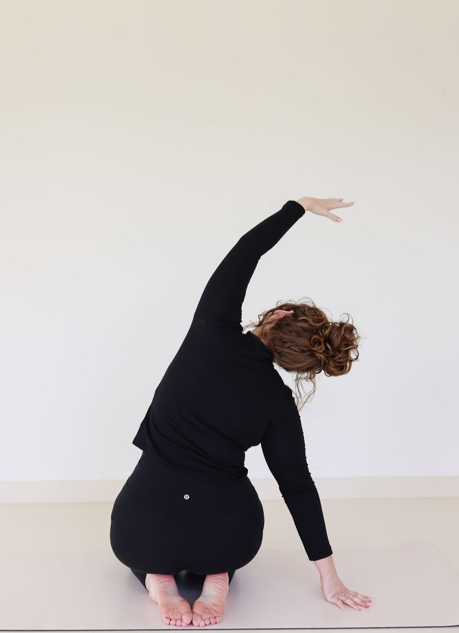 Nati Oron, owner of The Oasis, an Oakland fitness studio, doing mat Pilates.