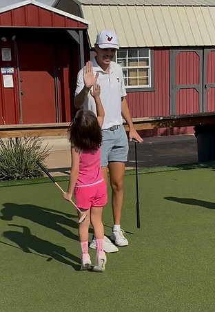 High Five between student and coach