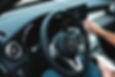 person holding a phone while driving.jpg