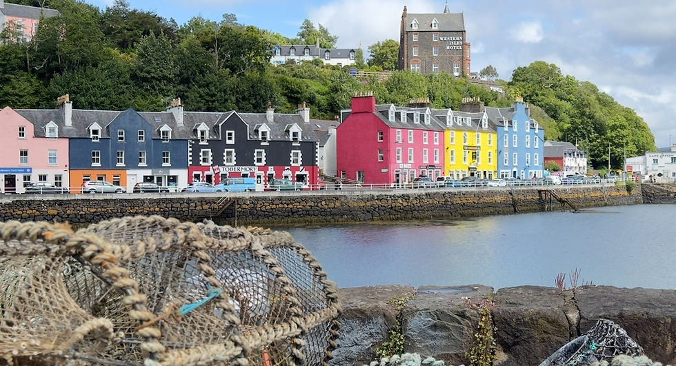 Eye-level view of a rocky coastline with waves crashing against cliffs