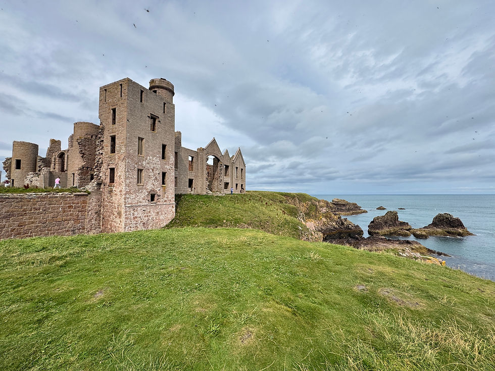 Eye-level view of Crathes Castle surrounded by lush greenery