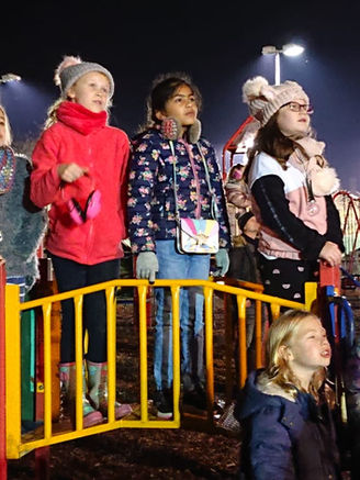 Children in Playground watching Fireworks