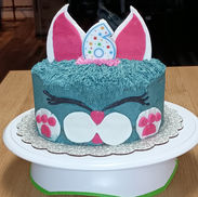 Cat Cake with Pink and White Ears with a Little Face and One Candle