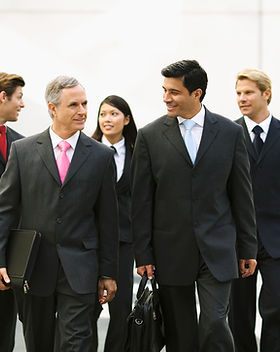 Business acquisition specialist walking to a meeting.