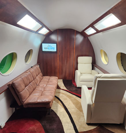 Private jet set at Encore Film And Music Studio in Atlanta, GA, featuring a luxury aviation film set on a professional soundstage for video production, photoshoots, and content creation.
