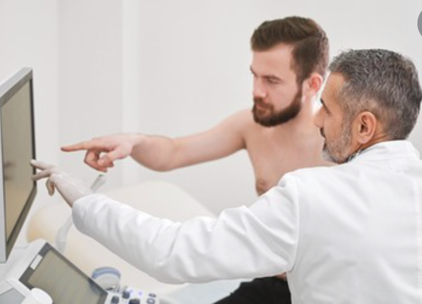 doctor examining a man for symptoms of erectile dysfunction