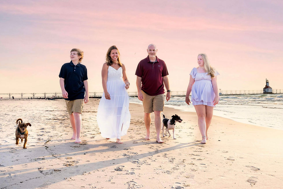 Stunning family portrait on a beach under the summer sun