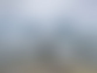 Standing on the rocky edge of Ilulissat, Greenland overlooking miles of fractured ice