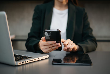 worker using laptop, tablet and phone