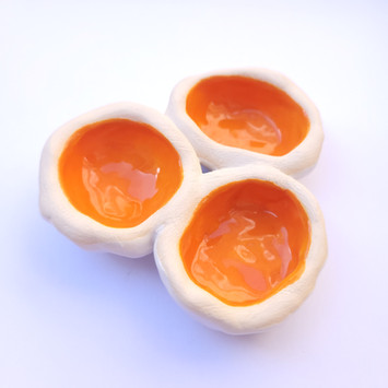 Hand made ceramic trinket dish with multiple pockets for your treasures, hand built and painted. Glazed in bright orange with white underside. 