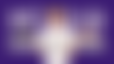 A young boy holding a tablet and a book