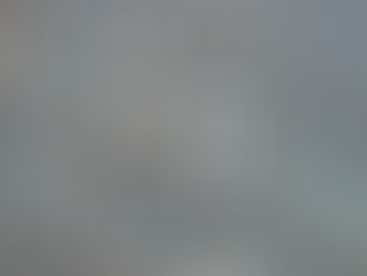 A necklace and earring set of diamond-shaped gemstones and round clear beads, accented with gold metal.