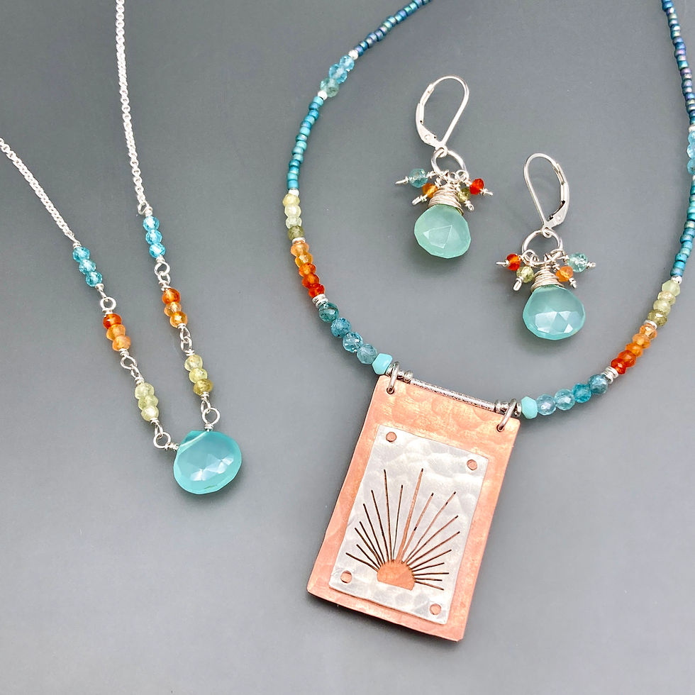 Earrings and necklaces made of brightly colored crystalline beads; stamped metal pendants; and silver chains & accents.