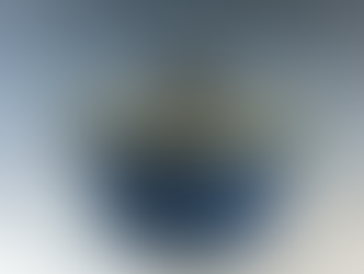 A deep blue clay pot with handles and a black-and-white checkered lid.