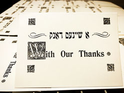 A stylized black and white print reading, "With our thanks."