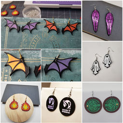 Several pairs of earrings in gothic and sci fi designs, such as bat wings, ghosts, and Hobbit doors.