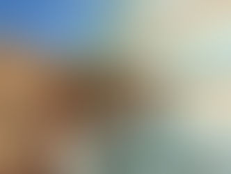 A landscape painting of moving water against rocky crags and blue sky.