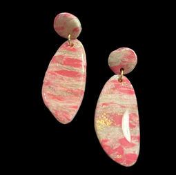 A pair of shiny pink and white stone earring with gold accents.