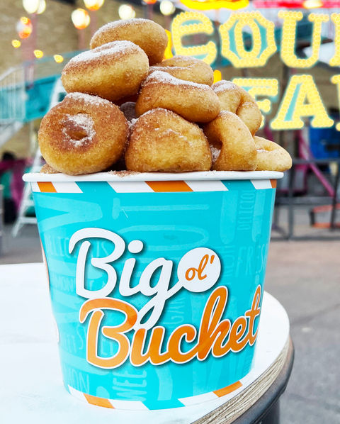 Big Ol' Bucket of mini donuts with sprinkled sugar on top.