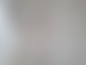 Residential carpet cleaning by certified technician using steam cleaner in Calgary.