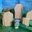 Thumbnail: image shows a selection of wooden toys including carved standing stones and a purple thistle on green with blue background.
